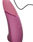 Womanizer Next rosa, sammetslen yta och knappar