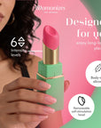 Grön Womanizer Beauty formad som ett läppstift, sidovy