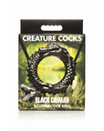 Creature Cocks Black Caiman Silicone Penisring förpackning mot vit bakgrund.