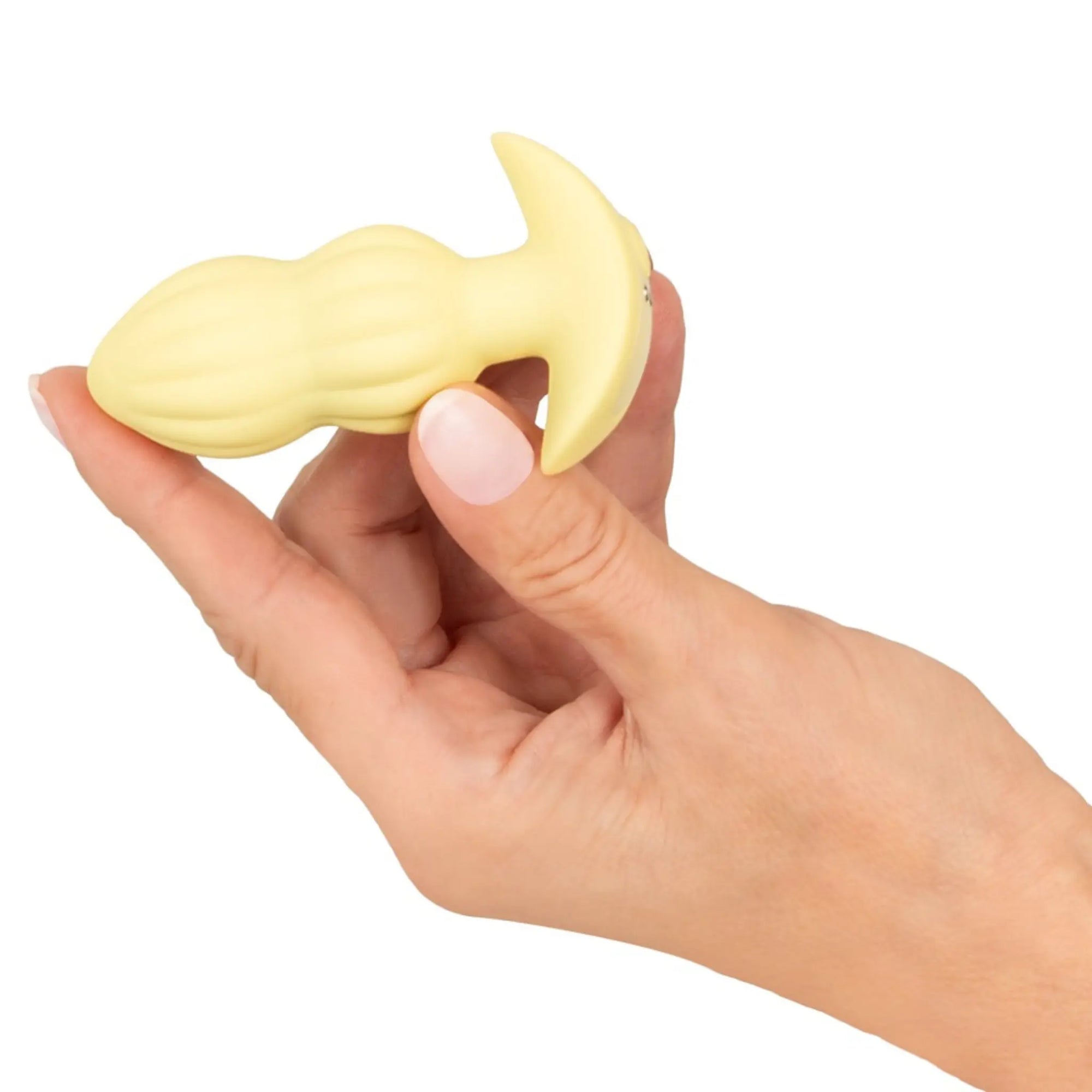 En hand håller i en Cuties Vibrerande Buttplug Gul