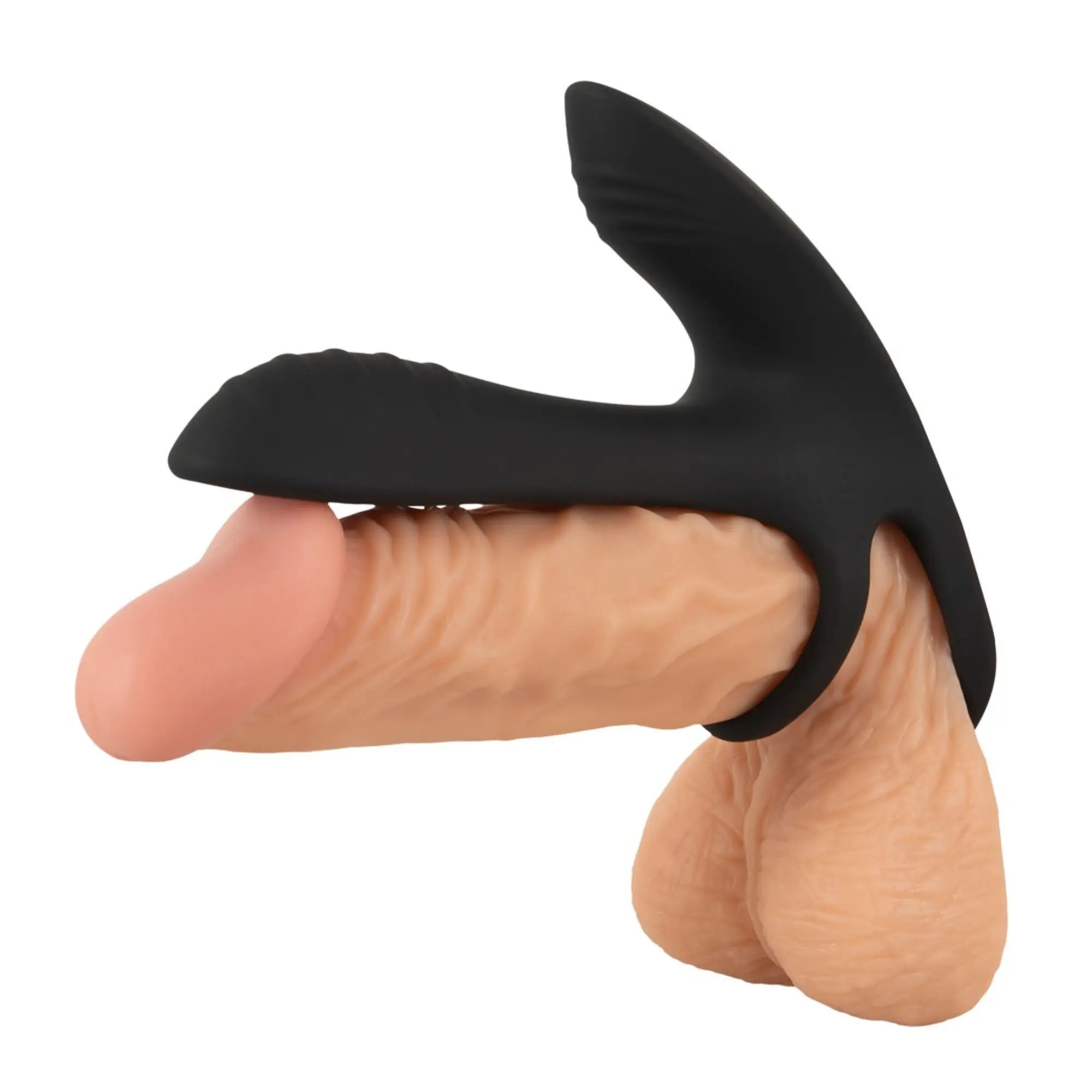 Bild på en dildo som har på sig samlagsvibratorn man får med i Magic Shiver Starter Set