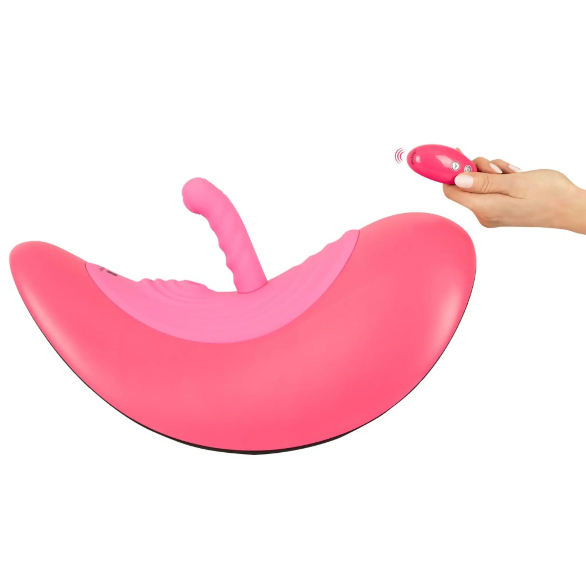 En hand står med fjärkontrollen Vibepad Ride On Gungande Sittvibrator