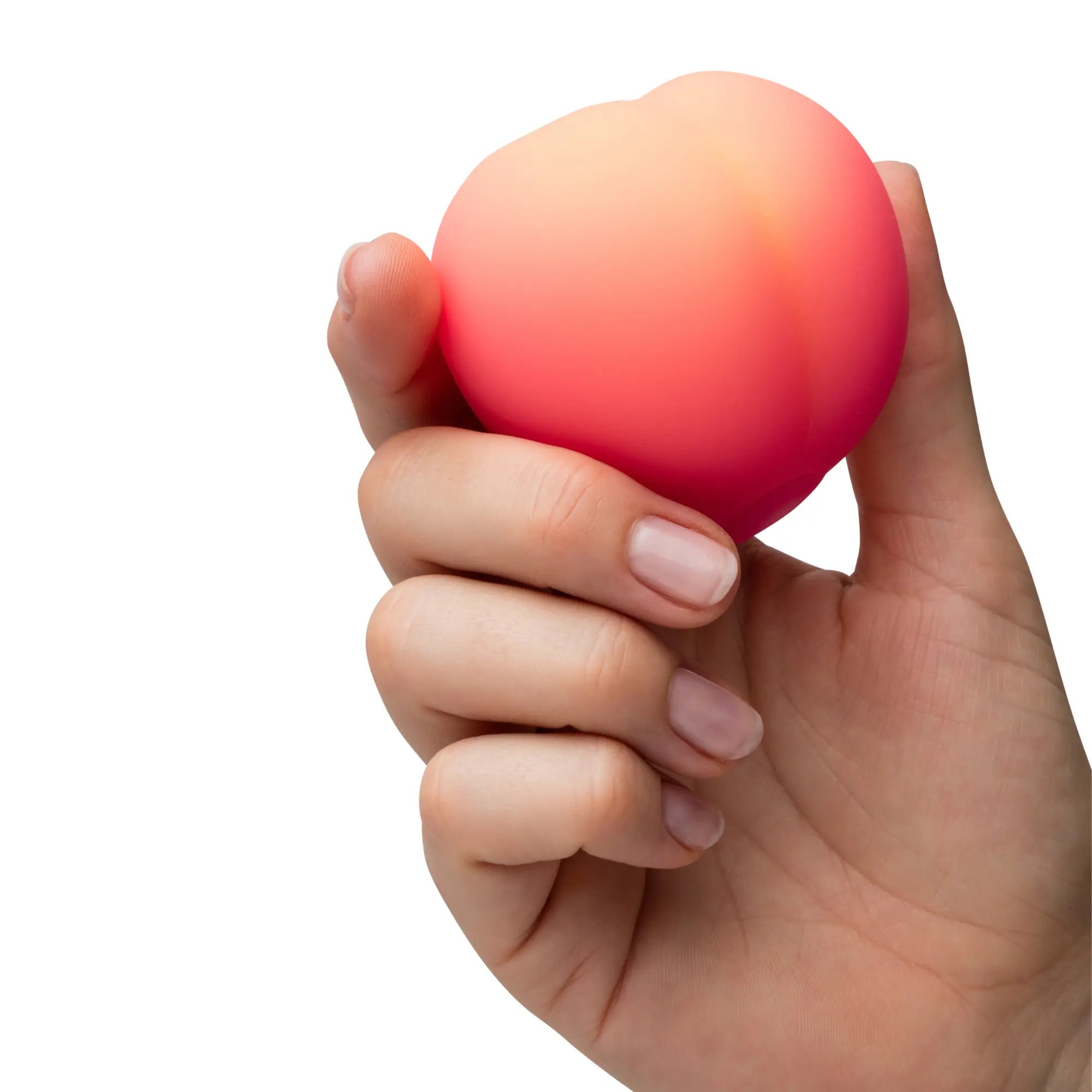 En hand håller i en Romp Peach Clitoral Stimulator