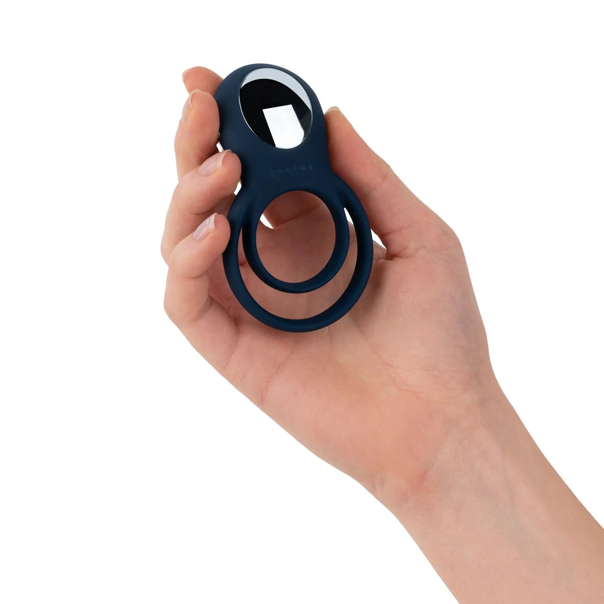 Hand håller i Boners Cock Ring med Vibrationer Blue