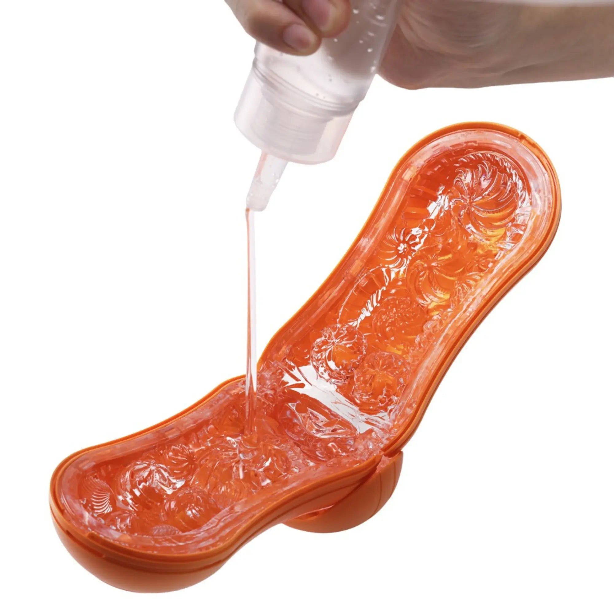Bild på Tenga Flip Orb Masturbator Orange med glidmedel i