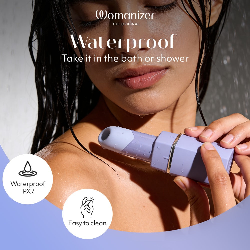 Lila Womanizer Beauty läppstiftsvibrator med skyddslock