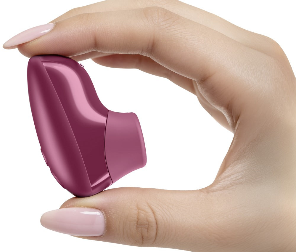 Rosa Womanizer Snap med 6 intensitetsnivåer och plusminusknappar