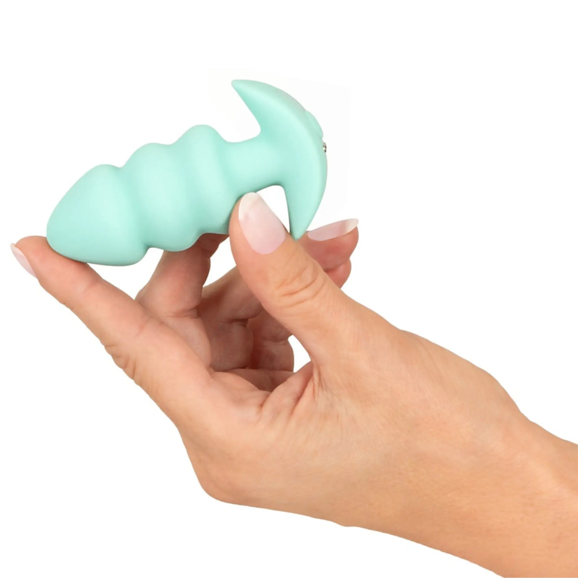 En hand håller i en Cuties Vibrerande Buttplug Green