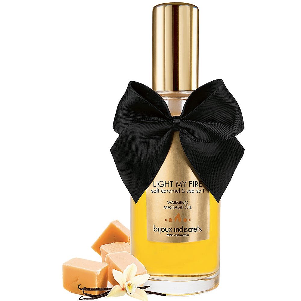 Soft Caramel Warming Oil mot vit bakgrund.