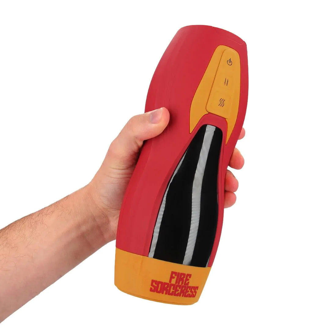 En hand håller i en Masturs Solara Fire Sorceress Masturbator