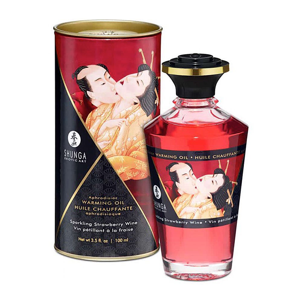 Shunga Aphrodisiac Oils Sparkling Strawberry Wine och produktförpackning mot vit bakgrund.