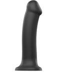 Dual Density Bendable Dildo L ståendes mot vit bakgrund.