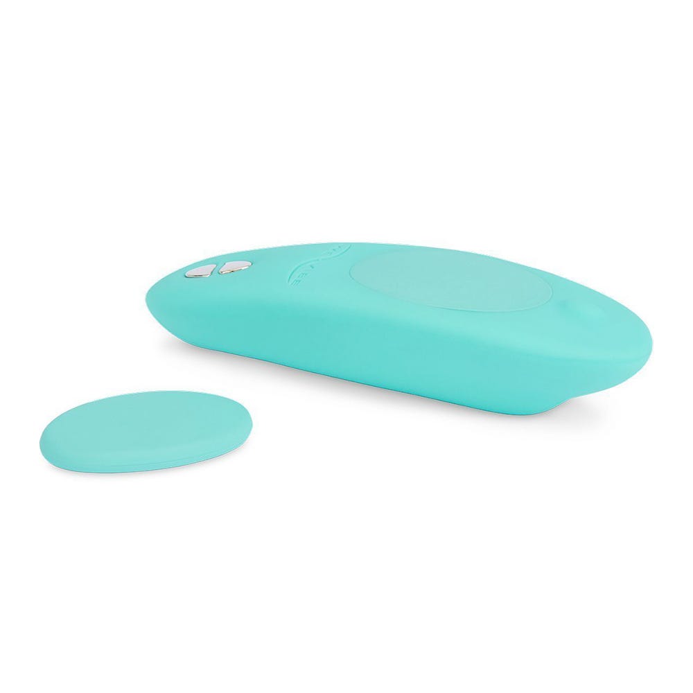 We-Vibe Moxie Trosvibrator och magnet mot vit bakgrund.