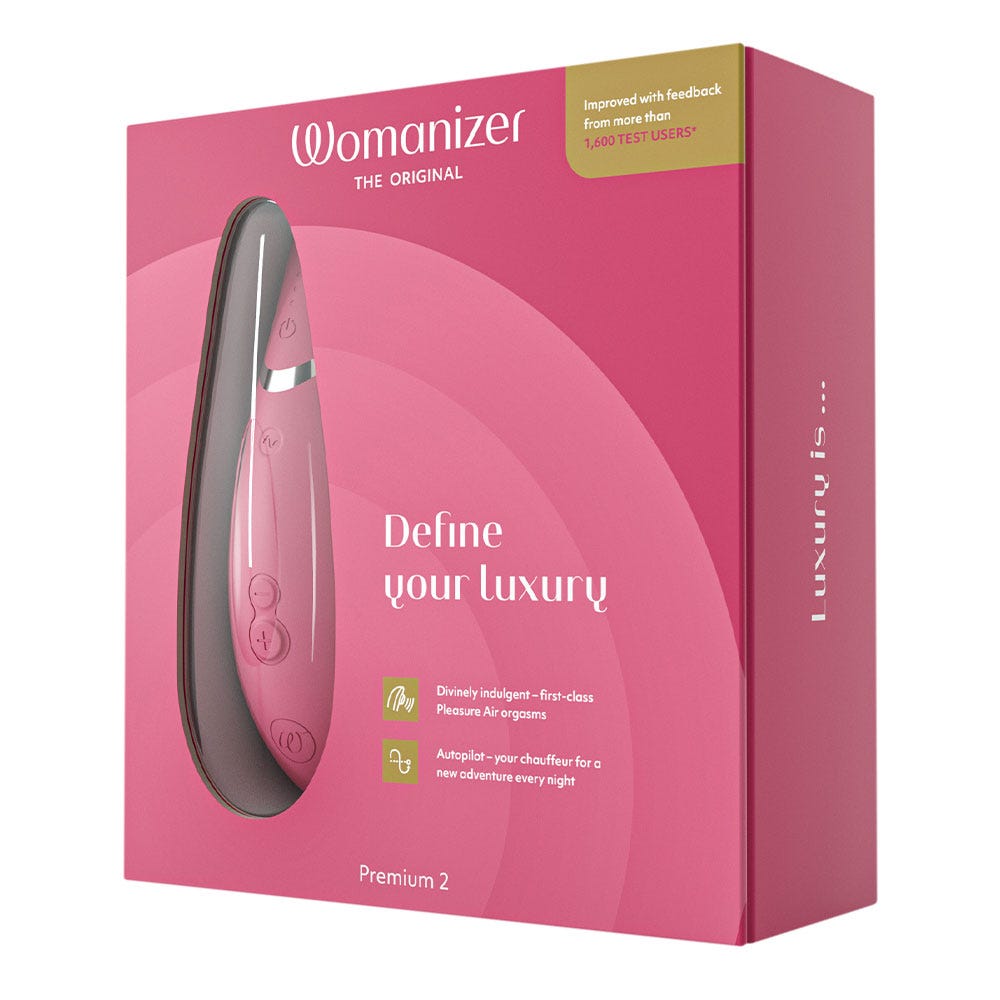 Womanizer Premium 2 Raspberry i en rosa låda som det står &quot;Define Your luxury&quot;