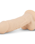 Deluxe Percy Realistisk Dildo liggandes mot vit bakgrund.