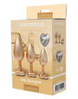 DreamToys Gleaming Love Gold Buttplug Set förpackning mot vit bakgrund.