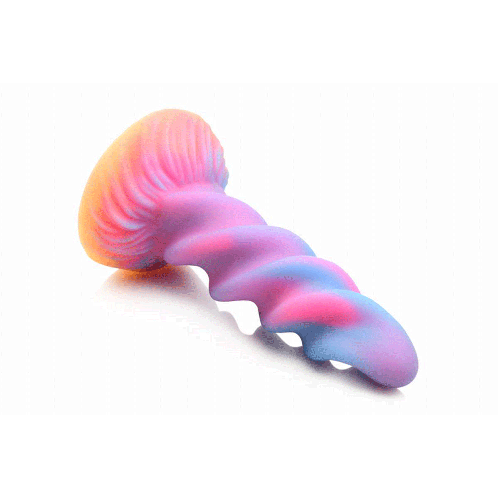 Glow-in-the-Dark Unicorn Dildo lutandes mot vit bakgrund.