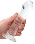 Hand som håller i Real Rock G-punktsdildo Transparent mot vit bakgrund.