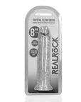 RealRock Dildo with Suction Cup Clear 20cm i en produktförpackning mot vit bakgrund.