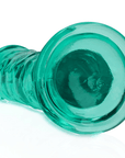 Botten av RealRock Dildo with Suction Cup Green 14,5cm. Grön sugpropp mot vit bakgrund.