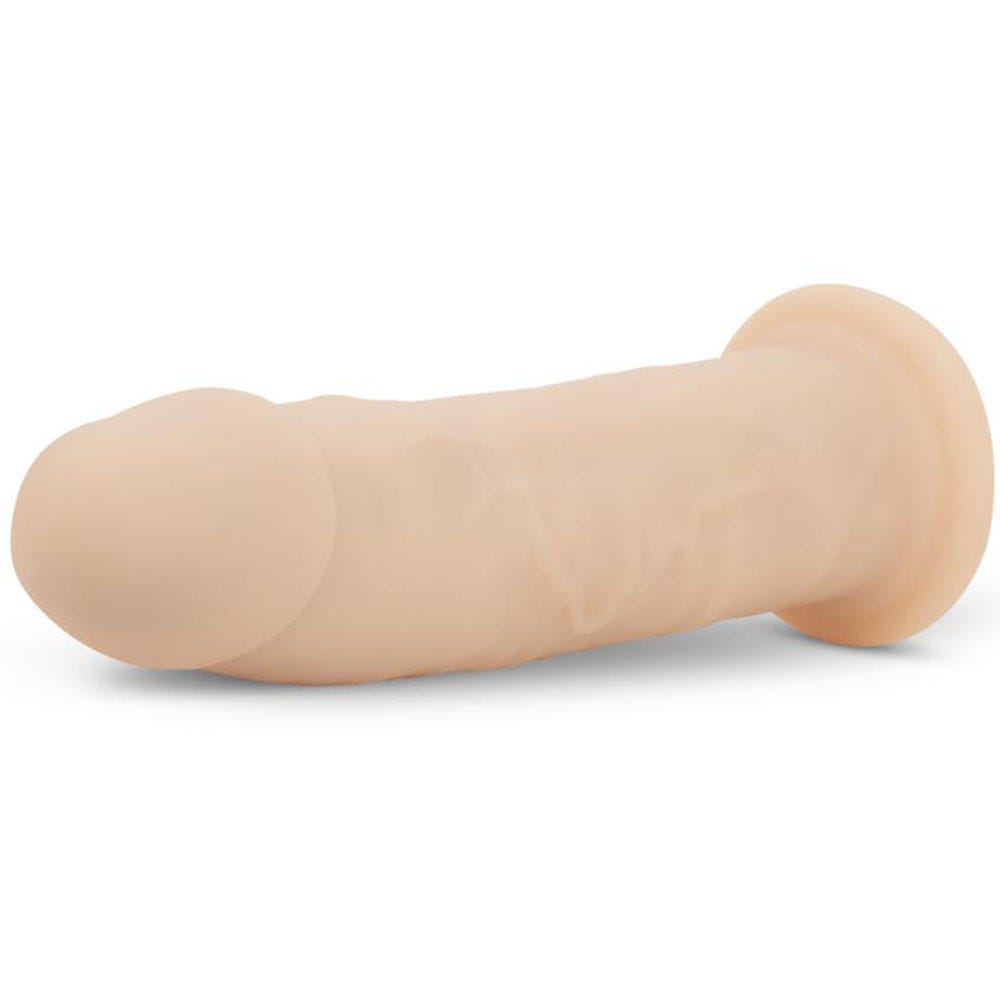 RF Deluxe Harris Realistic Dildo liggandes mot vit bakgrund.