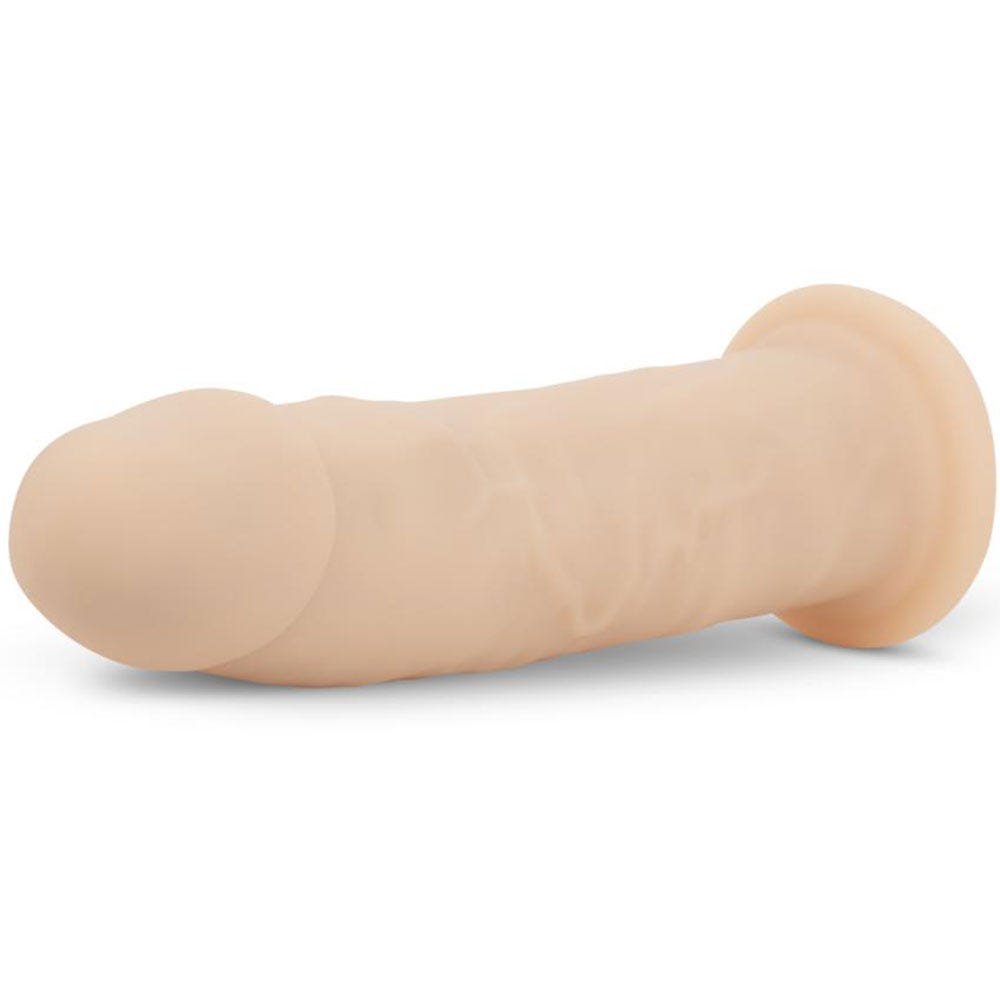 RF Deluxe Parker Realistic Dildo liggandes mot vit bakgrund.