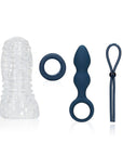 (S)explore Toy Kit for Him masturbator, penisring, analplugg och ball strap mot vit bakgrund.