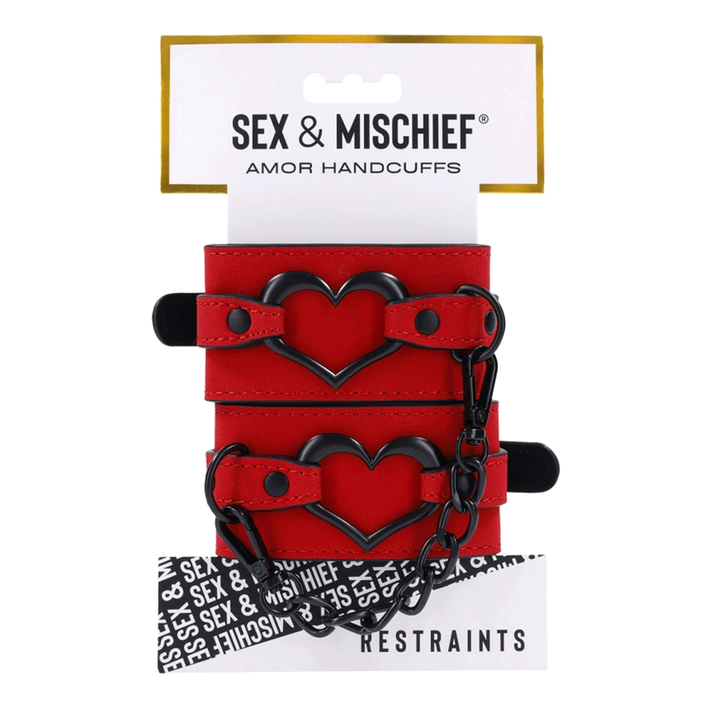 Sex &amp; Mischief Amor Handcuffs produktförpackning, framsida mot vit bakgrund.