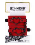 Sex & Mischief Amor Handcuffs produktförpackning, framsida mot vit bakgrund.