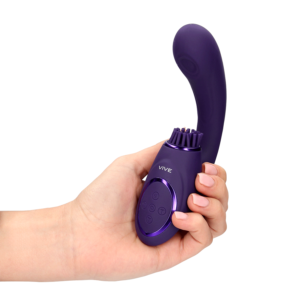 Hand som håller i VIVE Gen Rabbitvibrator med Borste Lila mot vit bakgrund.