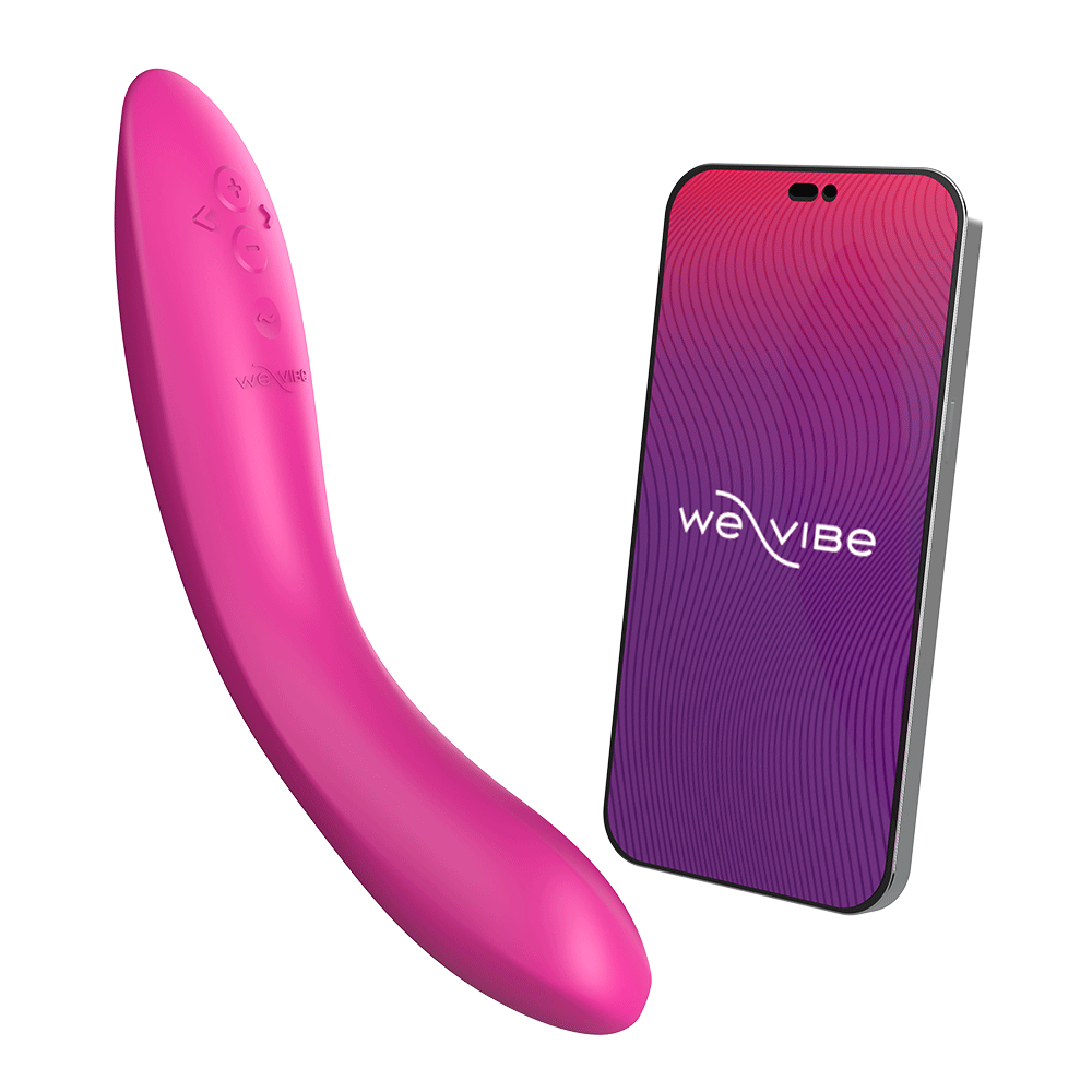 We-vibe Rave 2 Fuchsia bredvid en smartphone mot vit bakgrund.