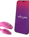 We-vibe Sync Appstyrd Parvibrator bredvid en smartphone med logga och rosa och lila färger