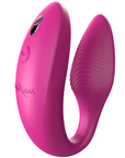 sned vinkel av rosa We-vibe Sync Appstyrd Parvibrator. Lite skuggat i U-formen.