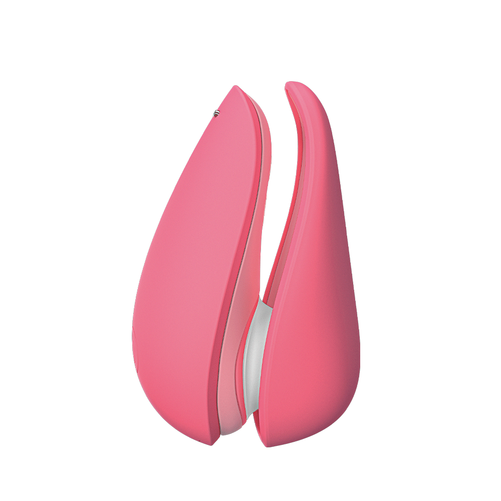 Womanizer Liberty 2 Vibrant Rose och lock mot vit bakgrund.