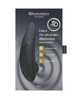 Womanizer Next Black produktförpackning mot vit bakgrund.