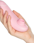 Womanizer Premium Eco Rose storleksdemonstration. Lufttrycksvibrator i en hand. Rosa färg.